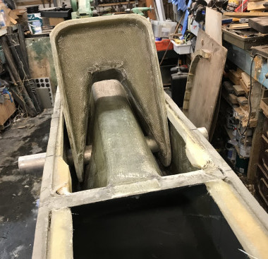 This is the GRP bracket which connects with the float hull, showing a trial fitting before the decks went on. The central bulkheads and reinforcing can be seen.